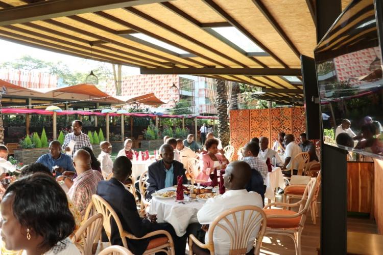 Guests and members of staff having a lunch