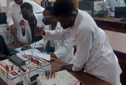 Fourth year students designing a PLC program for traffic lights control at a crossroad.